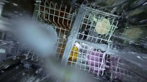 Inside View of Dishwasher with Water Spray and Rotating Arm Stockbeeldmateriaal 334309847