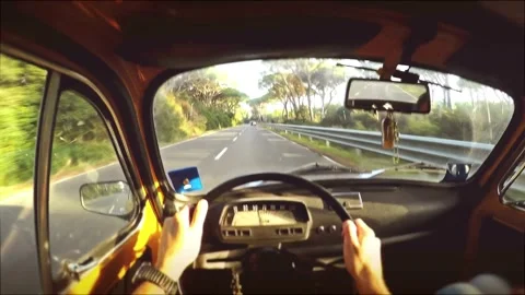 Inside view of Drivers holding steering wheel and driving on highway during day. Видео 336268941