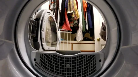 Inside view from dryer of being loaded by a woman, tumbling, and unloaded -2 Stock Footage 37303642