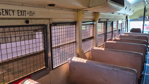 Inside view of emergency exit window in a prison bus Blue Bird of M.S.D.O.J Stock Footage 334698002