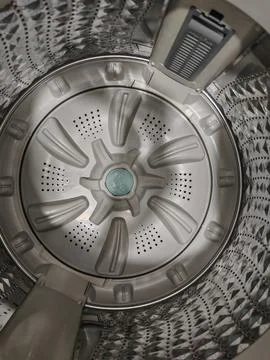 Inside View of an Empty Stainless Steel Washing Machine Drum Stock Photos