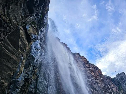 Inside view of Falls with stone cliffs and blue sky Stock Photos