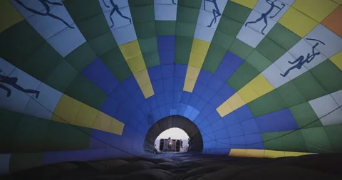 Inside view of a gas burner blowing up a hot air balloon as it is inflated for Stock-Footage 144251196