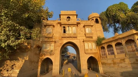Inside view of heritage gate of gadisar lake with view of boats in jaisalmer Video stock 282791323