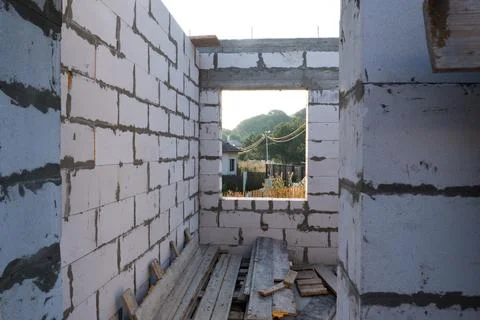 Inside view. House under construction, box of a house without a roof. View from Stock Photos