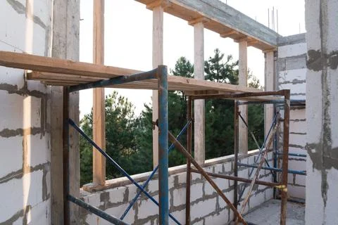 Inside view. House under construction, box of a house without a roof. View from Stock Photos