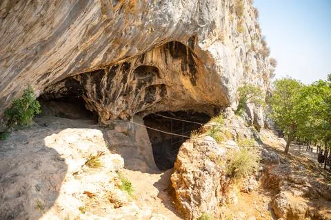 Inside view of Karain Cave in Antalya, with natural stalactites and stalagmites Stock Photos
