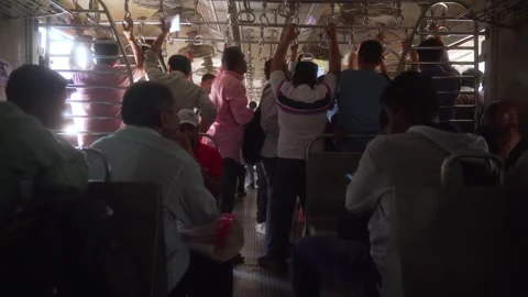 Inside view of local suburban train general compartment, packed with Stock Footage 310299817