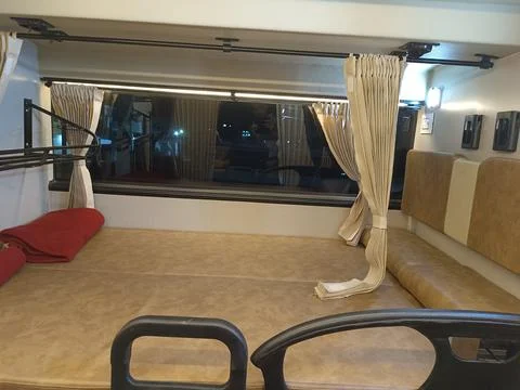 Inside view of a luxury sleeper bus for long route in India Photos