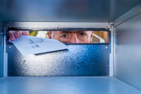 Inside view of a mail box, with a man delivering mail Stock Photos