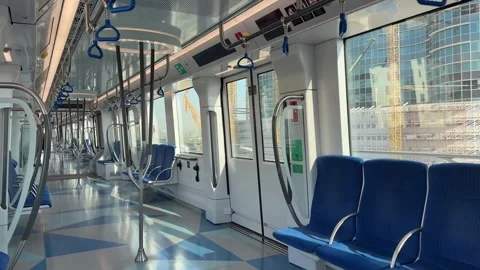 Inside view of modern Dubai metro train. The clean and empty metro carriage Stock Footage 306521345