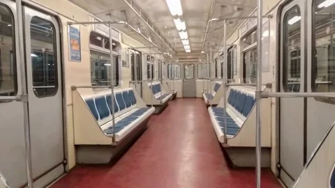 Inside view of the moving subway train carriage, empty seats in a subway car. Stock Footage 203254207