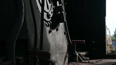 Inside view of old rusted abandoned steam locomotive parked in museum. Tilt up Stock Footage 138380380