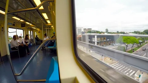Inside view of passengers in the wagon and traveling along of city Stockbeeldmateriaal 87221179