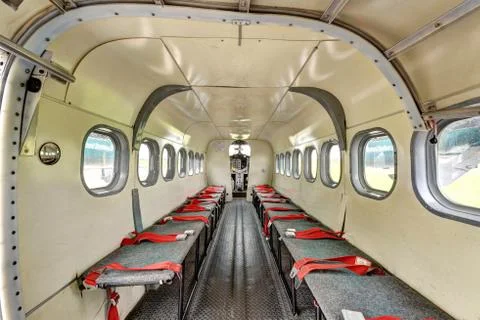 Inside view of seating for parachuting twin engine turbo prop looking forward Stock Photos