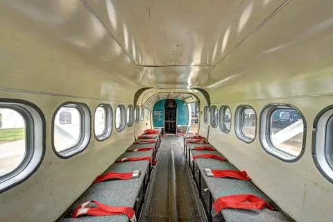 Inside view of seating for parachuting twin engine turbo prop looking aft Stock Photos