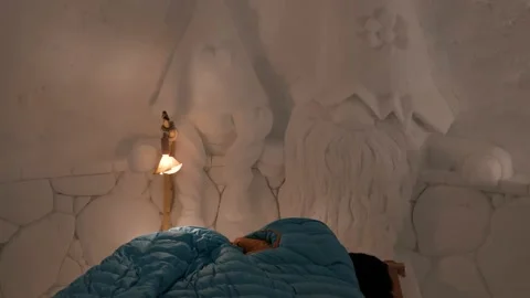 Inside view of snow iglu with bed and beautiful carved art, ice carving Stock Footage 147128094