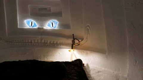 Inside view of snow iglu with bed and beautiful carved art, ice carving Stock Footage 147128110