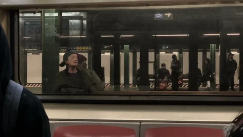 Inside view subway train carriage people station platform elderly man NYC Vídeo Stock 108199589