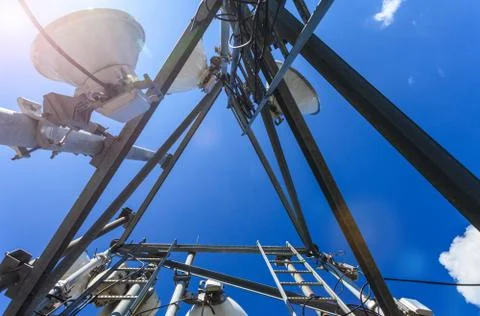 Inside view of telecommunication tower with microwave, radio antennas and cables Stock Photos