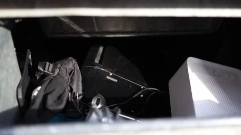 Inside view of a trash bin filled with discarded electronics and accessories, in Stock Footage 304885055