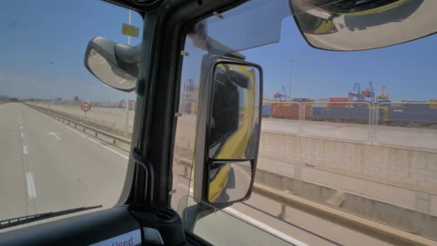 Inside view of truck cabin rolling inside freight sea port Stock Footage 143717917