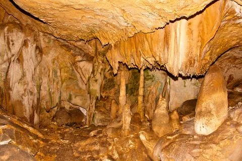 Inside view of an underground cavern or cave with stalagmites and stalactites Stock Photos