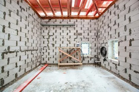 Inside view of working process of building house with wall made from foamed Stock Photos