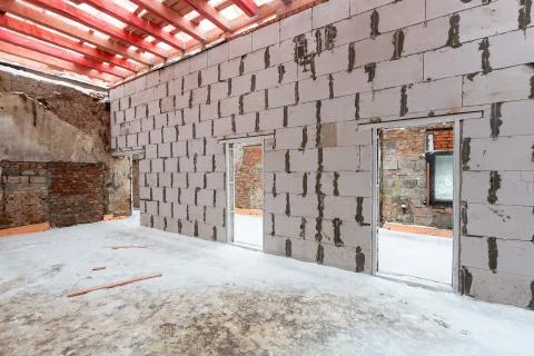 Inside view of working process of building house with wall made from foamed Stock Photos
