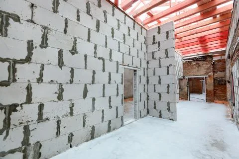 Inside view of working process of building house with wall made from foamed Stock Photos