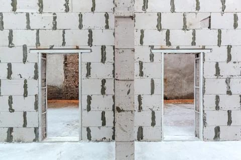 Inside view of working process of building house with wall made from foamed Stock Photos