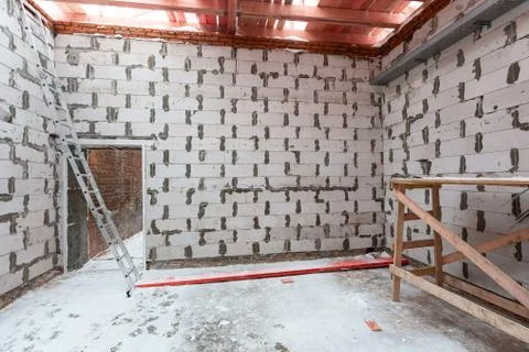 Inside view of working process of building house with wall made from foamed Stock Photos