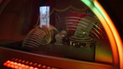 Inside Vintage Jukebox Showing Mechanical Components and Music Selection Video stock 332047270