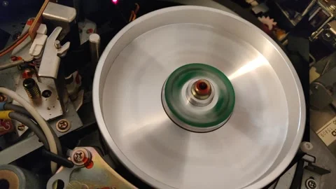 INSIDE A VINTAGE UMATIC  VIDEOTAPE RECORDER SHOWING HEAD DRUM AND TAPE Video stock 256730789
