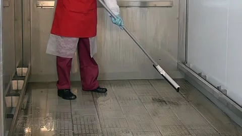 Inside a Walk-In Refrigerator Squeegeeing the Floor in the Morning Stock Footage 320138295