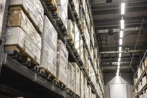 Inside A Warehouse With Rows Of Shelves Stock Photos