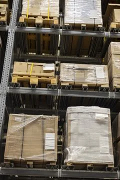 Inside A Warehouse With Rows Of Shelves Stock Photos