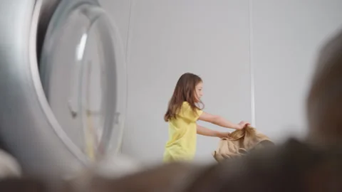 Inside Washer POV Kid Dancing With Towel Past Open Door 스톡 동영상 318840802