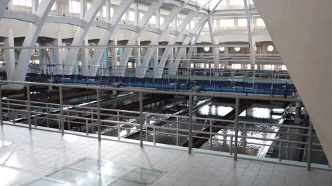 Inside a water treatment facility: sedimentation tanks, filtration channels, and Stock Footage 304884789