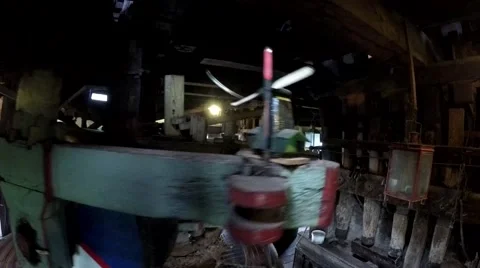 Inside windmill grinding peanuts and showing small decorative windmills 4k Stock Footage 53449859