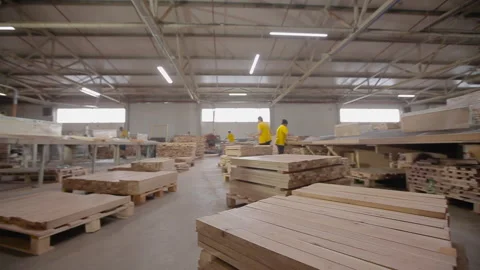 Inside the woodworking shop. Pieces of processed wood neatly folded. Working 库存影片 171133928