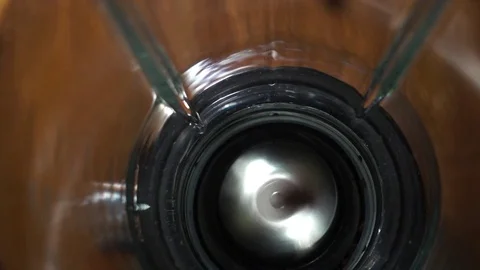 Inside in the working coffee grinder, top view slow motion video Stock Footage 82835622