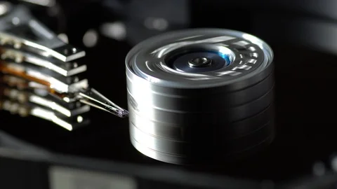 Inside a working computer hard disk drive vertical dolly shot Stock Footage 95215678