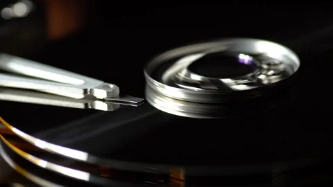 Inside a working computer hard disk drive spindle start stop read write data Stock Footage 95215741