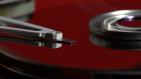 Inside a working computer hard disk drive red surface dolly shot Stock Footage 95282688