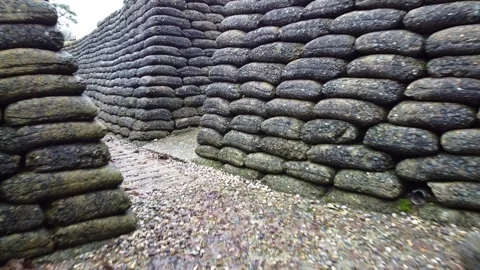 Inside a World War I trench. Walking through the trench. Military parapets made Stockbeeldmateriaal 344141104