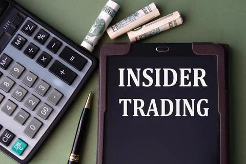INSIDER TRADING - words in an electronic notebook on the background of a calc Stock Photos