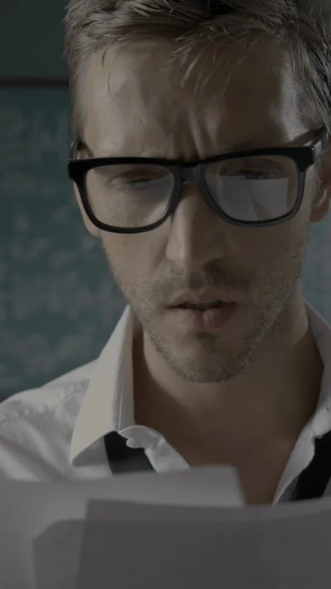 Insightful mathematician solving the problem, he writes a formula on the ch.. Stock Footage 293678765