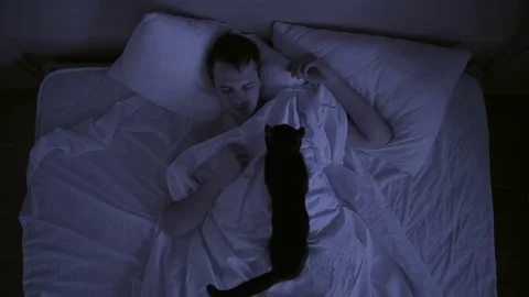 Insomnia concept. man in bed at night can not sleep, Time lapse Stock Footage 72580684