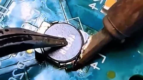 Inspecting and Repairing Electronic Component on Circuit Board Video Stock Footage 333900083